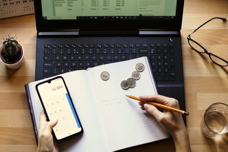 closeup shot entrepreneur working from home his personal finances savings scaled
