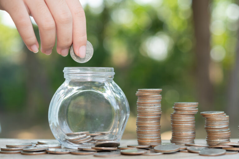 saving money concept preset by male hand putting money coin stack growing business arrange coins into heaps with hands content about money scaled