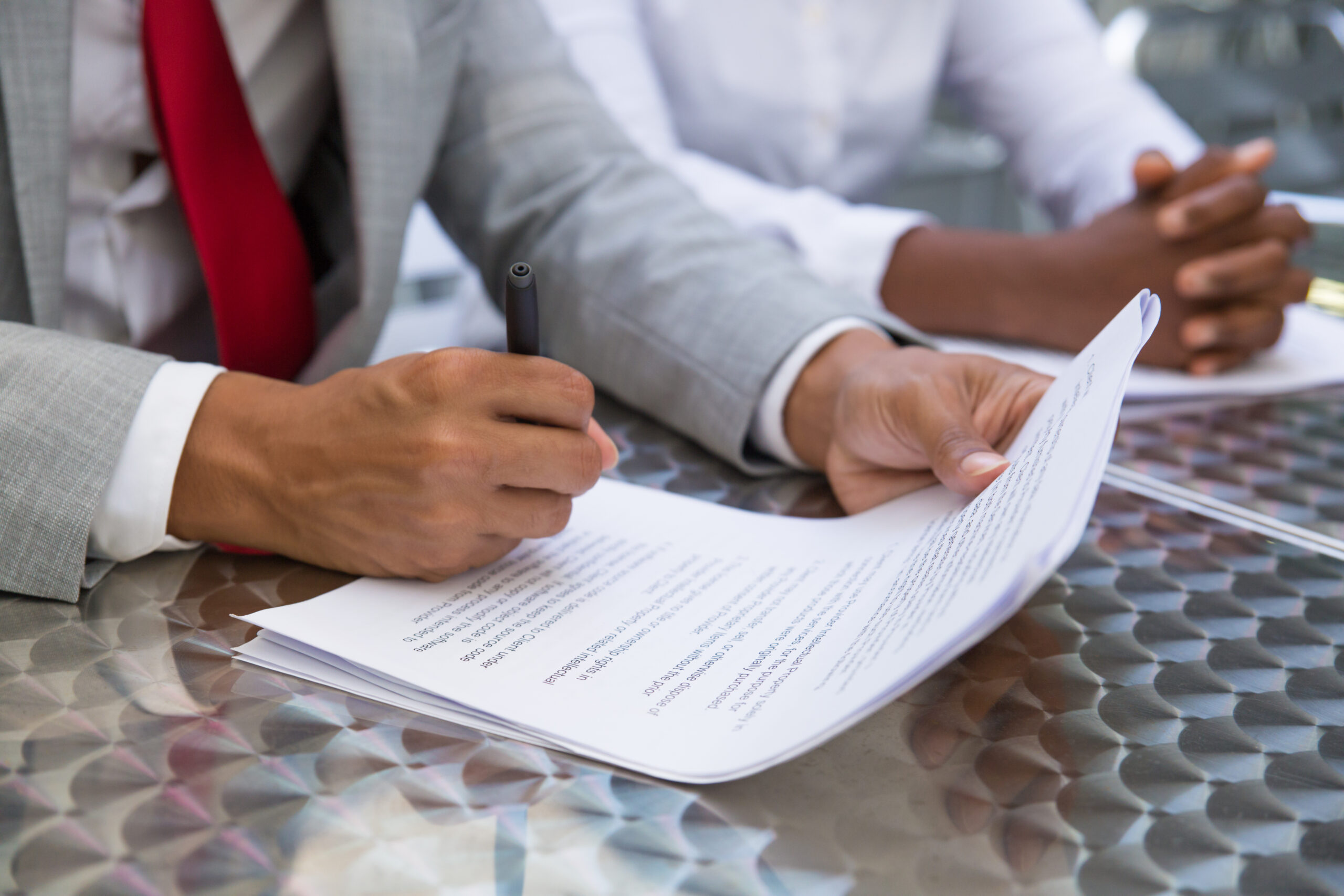business leader reading checking agreement text scaled