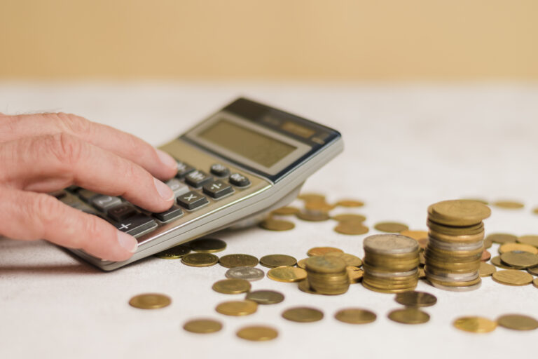 businessman calculating money scaled