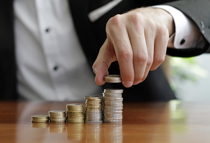 closeup shot businessman s hands counting stacks coins after business success 181624 57099